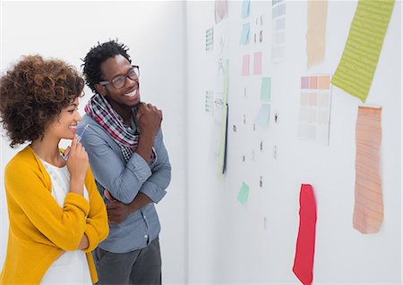 professionals whiteboard - Cheerful designers standing in front of material samples Stock Photo - Premium Royalty-Free, Code: 6109-06781479