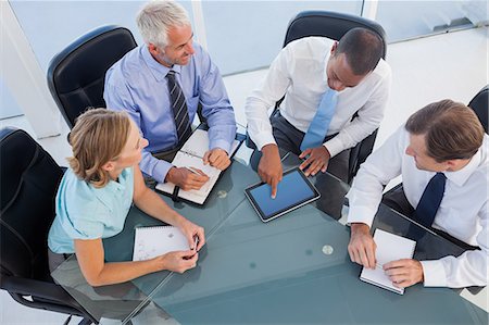 executives in a meeting - Business people using digital tablet Stock Photo - Premium Royalty-Free, Code: 6109-06781404