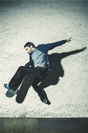 skateboarding - Skater mid air grabbing his board Stock Photo - Premium Royalty-Free, Code: 6109-06781431