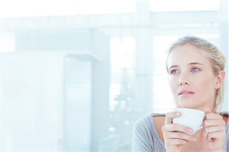 person drinking cup of coffee - Relaxed attractive woman drinking a cup of tea Stock Photo - Premium Royalty-Free, Code: 6109-06781540