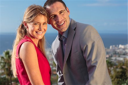 Delighted couple smiling at camera Stock Photo - Premium Royalty-Free, Code: 6109-06781588