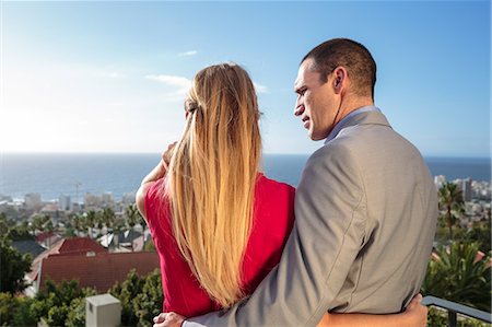 Rear view of a couple on balcony Photographie de stock - Premium Libres de Droits, Code: 6109-06781592