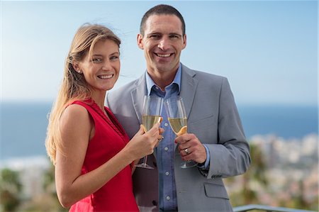 sophisticated luxury - Delighted couple clinking champagne Stock Photo - Premium Royalty-Free, Code: 6109-06781596