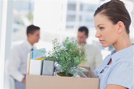 dismissal - Annoyed businesswoman leaving office after being let go Stock Photo - Premium Royalty-Free, Code: 6109-06781524