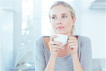 relaxing - Delighted woman holding a cup Stock Photo - Premium Royalty-Free, Code: 6109-06781538