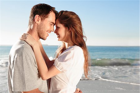 snuggle - Attractive couple relaxing on the beach Stock Photo - Premium Royalty-Free, Code: 6109-06781665