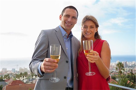 simsearch:6109-08435469,k - Couple holding glass of champagne Stock Photo - Premium Royalty-Free, Code: 6109-06781613