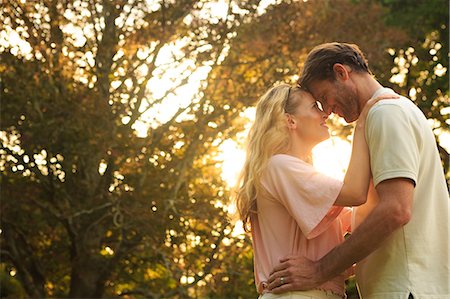 rural green - Lovers relaxing in a park under the sun Stock Photo - Premium Royalty-Free, Code: 6109-06781732