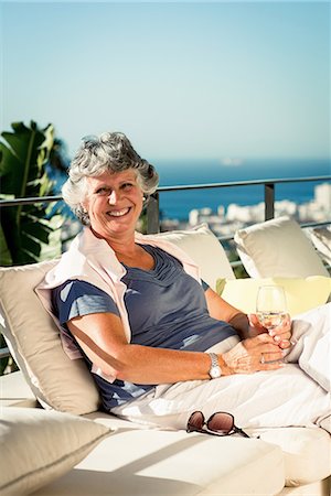 simsearch:689-03129854,k - Cheerful mature woman relaxing outdoors Stock Photo - Premium Royalty-Free, Code: 6109-06781893