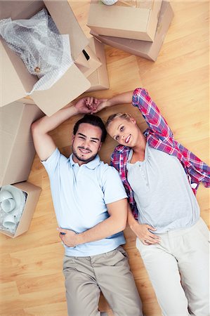 relaxing wood floor guy - Young lovers resting on the wooden floor Stock Photo - Premium Royalty-Free, Code: 6109-06782000