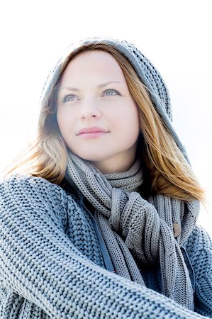 smiling in the wind with scarf - Portrait of a beautiful woman wearing a scarf Stock Photo - Premium Royalty-Free, Code: 6109-07496989