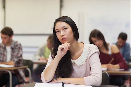 simsearch:6109-07497607,k - Focused asian student listening in class at the university Foto de stock - Sin royalties Premium, Código: 6109-07497578