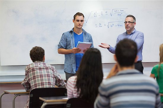 Student about to present his work in classat the university Stock Photo - Premium Royalty-Free, Image code: 6109-07497606