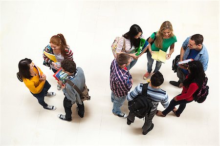 Happy students chatting together in a hall at the university Foto de stock - Sin royalties Premium, Código: 6109-07497626