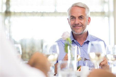 simsearch:6109-07600904,k - Businessman dining with colleagues the table Stock Photo - Premium Royalty-Free, Code: 6109-07600896