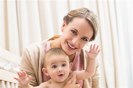 simsearch:6109-08945241,k - Happy mother with playful baby boy Stock Photo - Premium Royalty-Free, Code: 6109-07601001