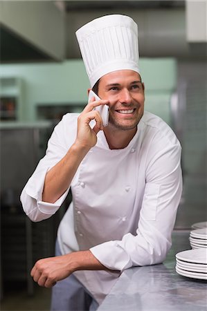Happy chef talking on the phone Stock Photo - Premium Royalty-Free, Code: 6109-07601165