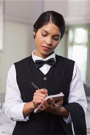 silver service - Pretty waitress taking an order Stock Photo - Premium Royalty-Free, Code: 6109-07601184