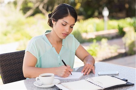 Serious businesswoman having coffee and planning her week Stock Photo - Premium Royalty-Free, Code: 6109-07601198