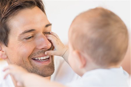 Father playing with his baby son Stock Photo - Premium Royalty-Free, Code: 6109-07601248