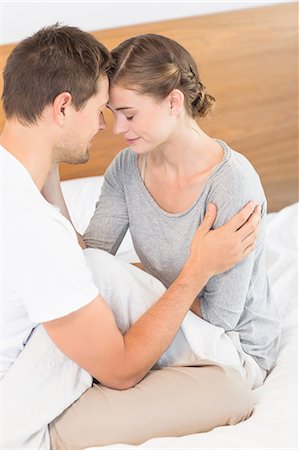 simsearch:6109-07601273,k - Close couple sitting on bed Stock Photo - Premium Royalty-Free, Code: 6109-07601257