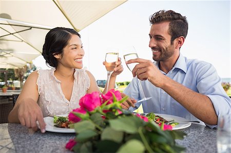 simsearch:6109-07601224,k - Happy couple celebrating their anniversary with champagne Foto de stock - Sin royalties Premium, Código: 6109-07601235