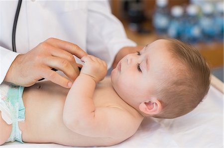 Pediatrician checking baby boy Stock Photo - Premium Royalty-Free, Code: 6109-07601343