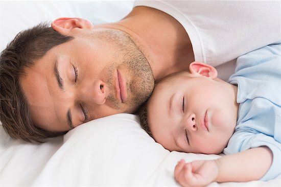 Father and baby son sleeping Stock Photo - Premium Royalty-Free, Image code: 6109-07601315