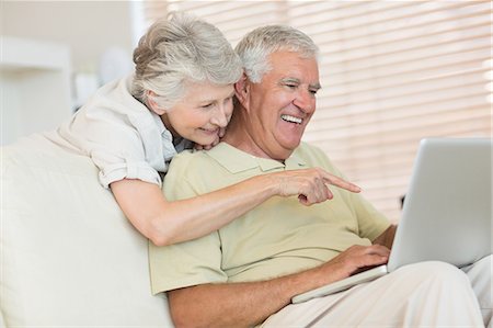 elderly couple in home - Happy senior couple using the laptop together Photographie de stock - Premium Libres de Droits, Code: 6109-07601446