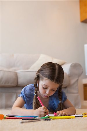 simsearch:6109-07601494,k - Close-up of a little girl drawing in living room Stock Photo - Premium Royalty-Free, Code: 6109-07601497