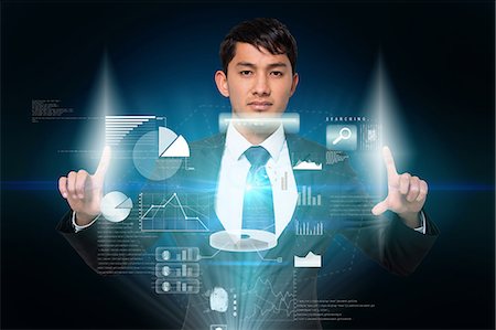 simsearch:6109-07601741,k - Serious businessman touching interface Stock Photo - Premium Royalty-Free, Code: 6109-07601592