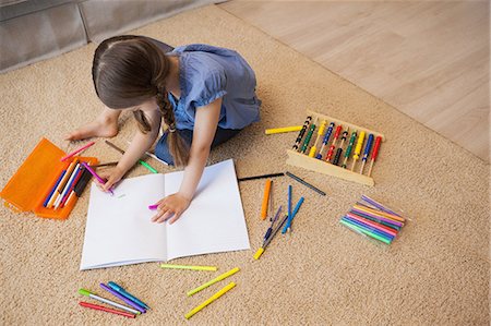 drawing - Full length of a little girl drawing in living room Stock Photo - Premium Royalty-Free, Code: 6109-07601502