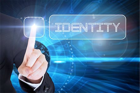 simsearch:6109-07601741,k - Businesswomans finger touching Identity button Stock Photo - Premium Royalty-Free, Code: 6109-07601715