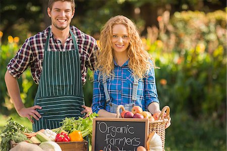 simsearch:6109-08204305,k - Couple selling organic vegetables at market Stock Photo - Premium Royalty-Free, Code: 6109-08203074