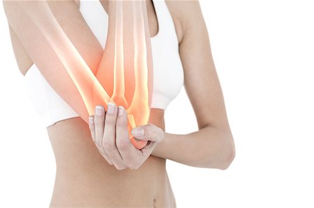 Highlighted elbow pain of woman Photographie de stock - Premium Libres de Droits, Code: 6109-08203011