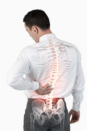 Highlighted spine of man with back pain Stock Photo - Premium Royalty-Free, Code: 6109-08203015