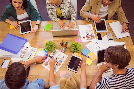 professional (pertains to traditional blue collar careers) - Creative colleagues with laptop and digital tablet office Foto de stock - Sin royalties Premium, Código: 6109-08203162