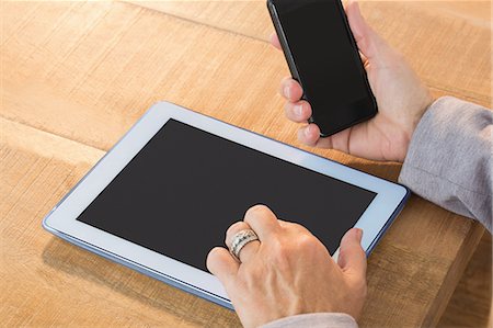 screen - Close up of woman using smartphone and tablet Stock Photo - Premium Royalty-Free, Code: 6109-08203272