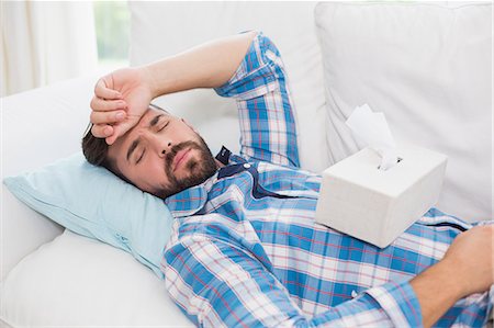 sick man - Handsome man sleeping in the sofa Stock Photo - Premium Royalty-Free, Code: 6109-08203576