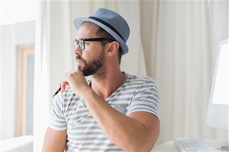 Thoughtful handsome man looking away Stock Photo - Premium Royalty-Free, Code: 6109-08203640