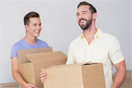 simsearch:6109-08203666,k - Happy homosexual couple holding box Stock Photo - Premium Royalty-Free, Code: 6109-08203674