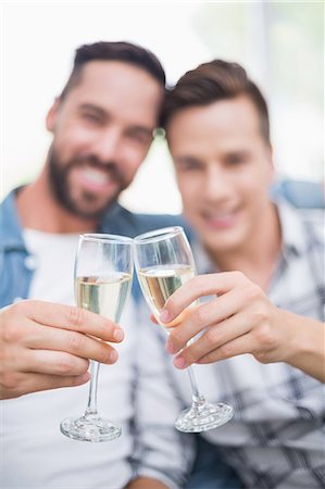 simsearch:6109-08203595,k - Homosexual couple men toasting with a champagne flute Stock Photo - Premium Royalty-Free, Code: 6109-08203608