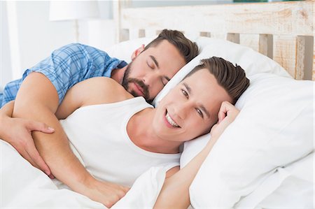 Homosexual couple lying on bed Stock Photo - Premium Royalty-Free, Code: 6109-08203710