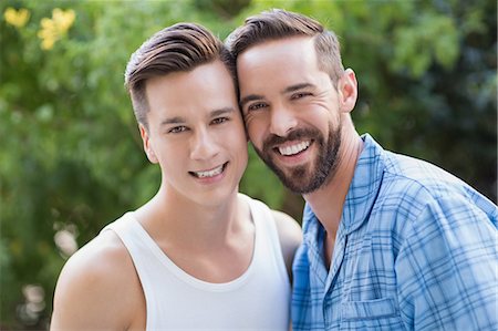 Happy homosexual couple looking at camera Stock Photo - Premium Royalty-Free, Code: 6109-08203717