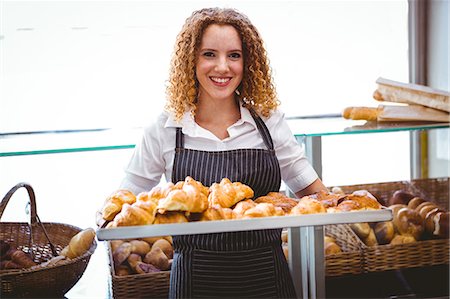 simsearch:6109-08489751,k - Happy pretty barista holding plate with pastry Photographie de stock - Premium Libres de Droits, Code: 6109-08203852