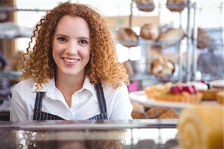 serving the foods - Happy pretty barista looking at camera Stock Photo - Premium Royalty-Free, Code: 6109-08203830