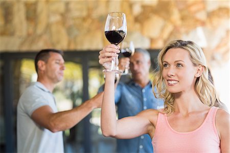 simsearch:6109-08394929,k - Smiling woman with wineglass in front of group doing wine tasting Stockbilder - Premium RF Lizenzfrei, Bildnummer: 6109-08203989