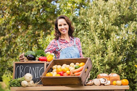 farmers market female - Pretty blonde selling organic vegetables at market Stock Photo - Premium Royalty-Free, Code: 6109-08204266