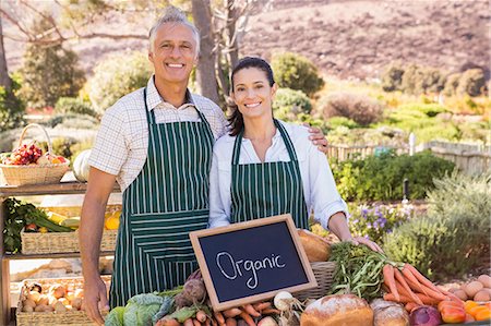 simsearch:6109-08488666,k - Couple selling organic vegetables at market Stock Photo - Premium Royalty-Free, Code: 6109-08204296