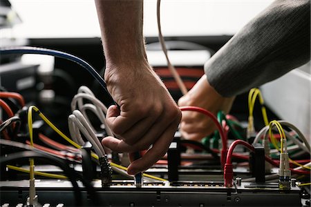 system - Team of technicians working together on servers Stock Photo - Premium Royalty-Free, Code: 6109-08389885